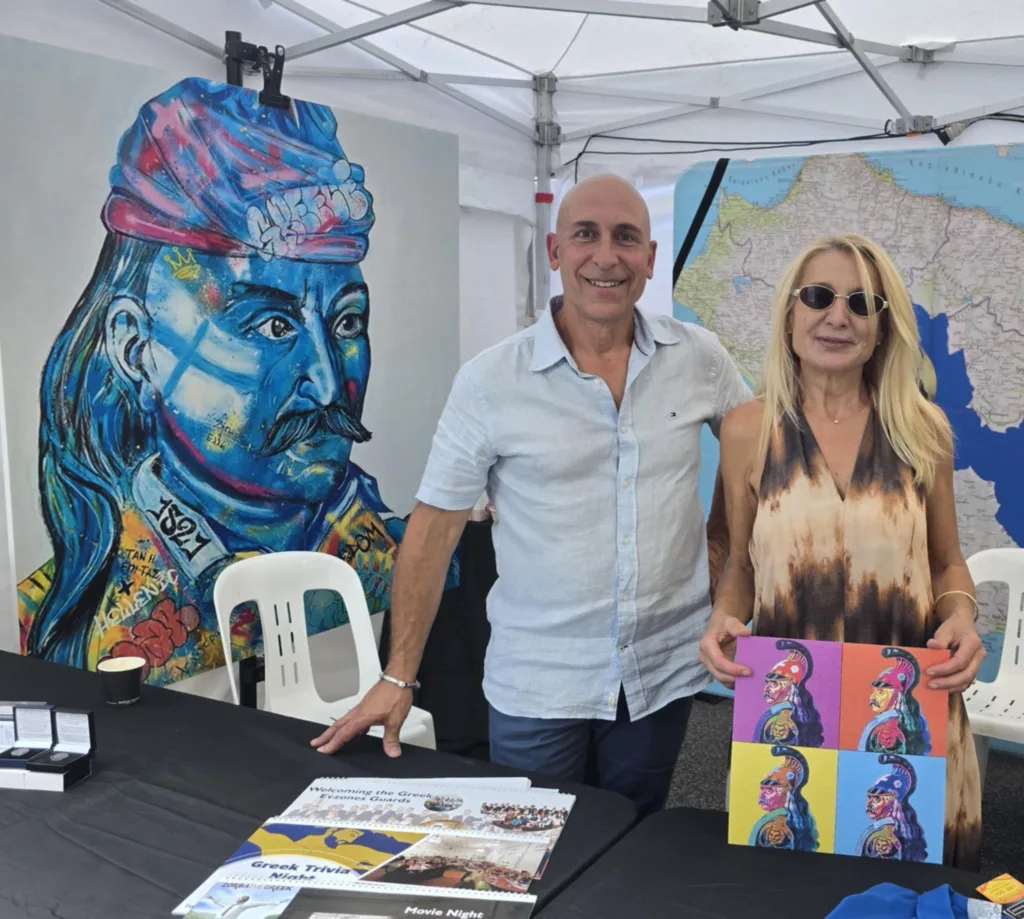 President George Kotsirilos and Vice President Betty Dimitropoulos with Kolokotronis-inspired artworks