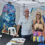 President George Kotsirilos and Vice President Betty Dimitropoulos with Kolokotronis-inspired artworks