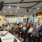 Cyprus Capital board member Dorothy Costa having a crack at Morgan Kelly at the member meeting. Photo copyright The Greek Herald.