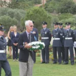 Peter Ford at Souda Bay War Cemetery laying a wreath for Anzacs