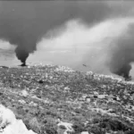 Smoke_hanging_over_the_habour_in_Suda_Bay