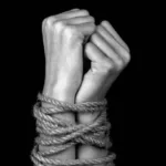 hands tied with a rope close-up black background monochrome