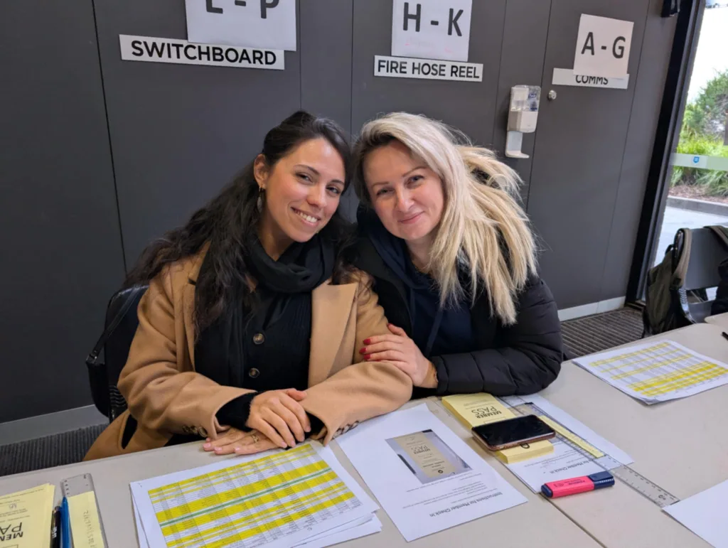 Greek school teachers Maria Vikatou Kounadi and Anthi Tzani sign in members