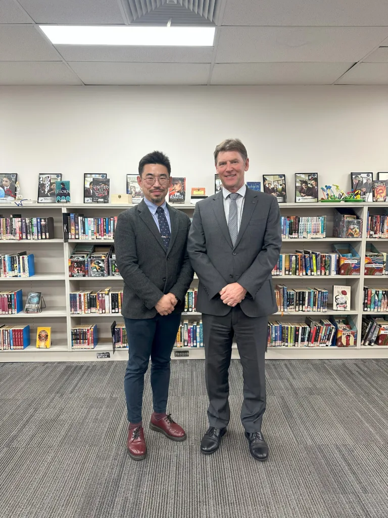 Principal Robertson with Guang Wu