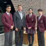 12. Principal Mark Robertson with Monash Scholars recipients