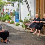 Greek-yiayias-in-the-village-shutterstock_1031819689-1568×1045-1