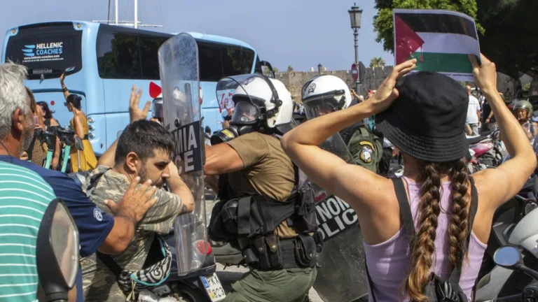 Riot police clash with Gaza protesters during Israeli cruise stop in Rhodes