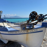 Boat on Kiato beach (photo by Rye Pothakos)
