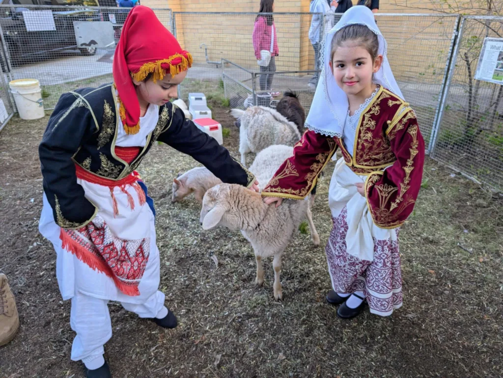 Cretan Brotherhood dancers at the petting zoo