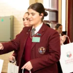 16.-Students-hand-out-gift-bags-to-guests