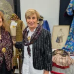 Gina Gekas and Christine Dimer infront of a garment heirloom worn by members of Dimer’s family feature
