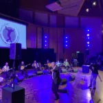 Attendees-join-musicians-on-stage-for-a-zeibekiko