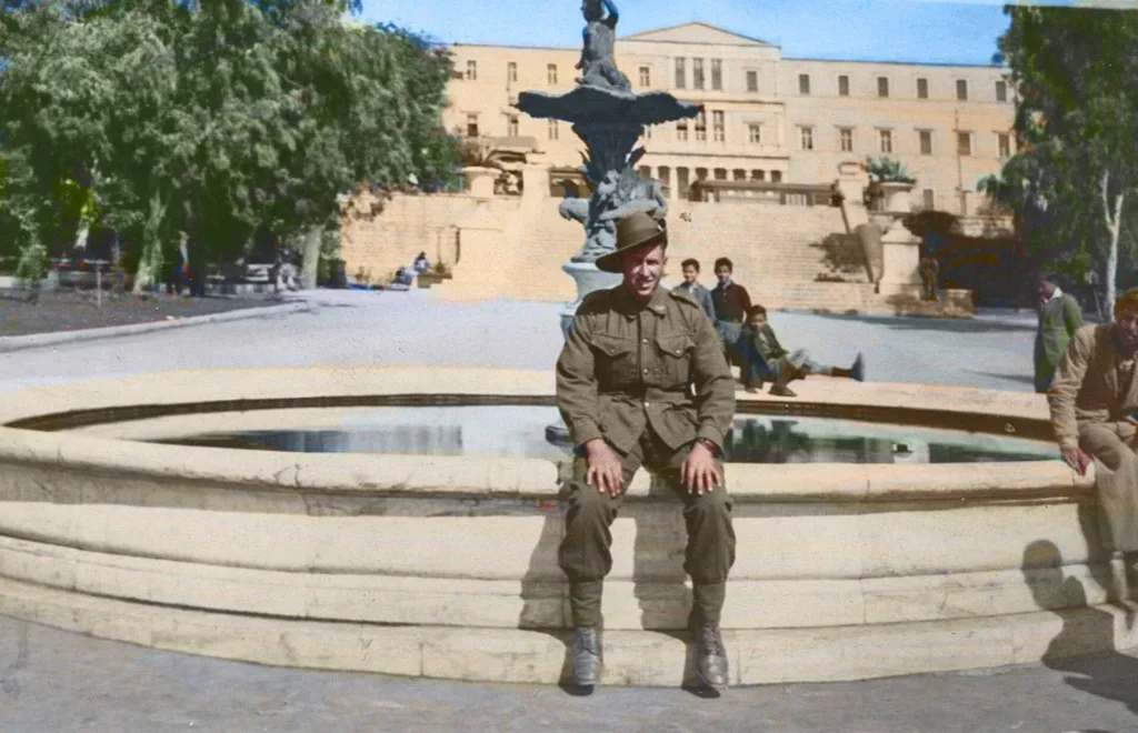 Private Kevin Byrne sitting at the Syntagma Square Fountain during WWII