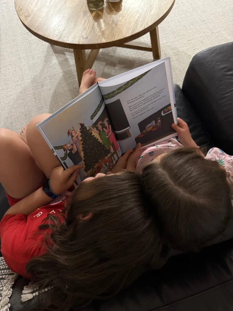 Characters Maree and Melanie reading the book