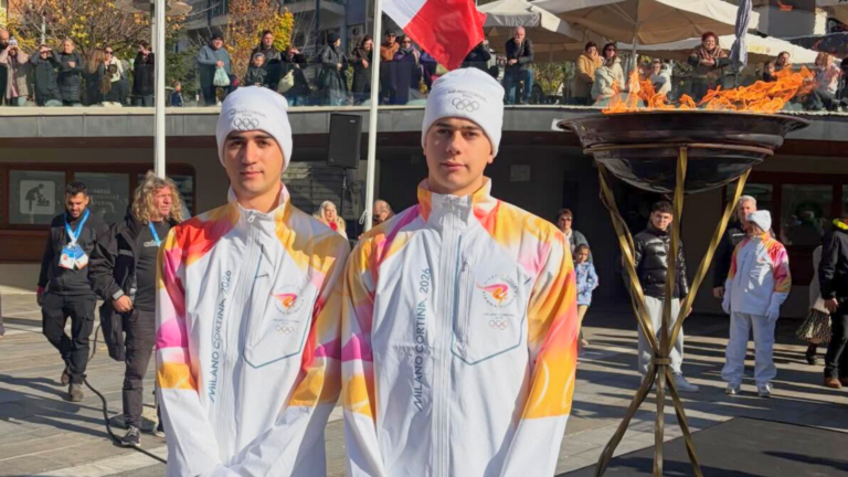 Greek Australian brothers George and Sotiris Tsianakas carry Winter Olympic Flame