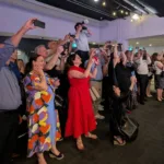 POTENTIAL HERO PHOTO Proud parent paparazzi capturing the moment