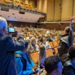 Parents-from-rows-below-wave-to-their-children-upstairs