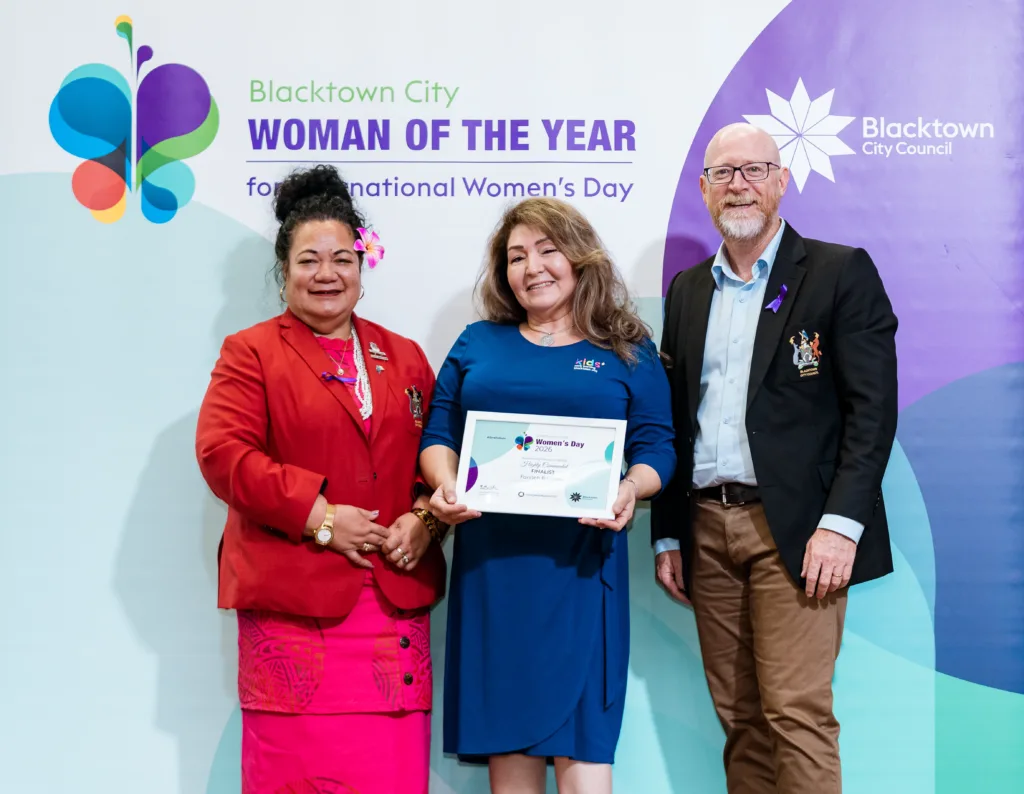 Mayor Brad Bunting and Cr Talia Amituanai congratulate staff Woman of the Year Farideh Bahrami