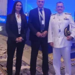 Aliki Chatzara is pictured with Greece’s National Security Advisor, Thanos Dokos, and Rear Admiral Vasileios Gryparis, Commander of the European Operation ASPIDES.