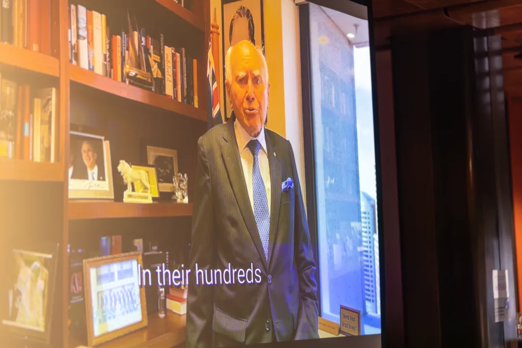 john howard message the greek herald 100